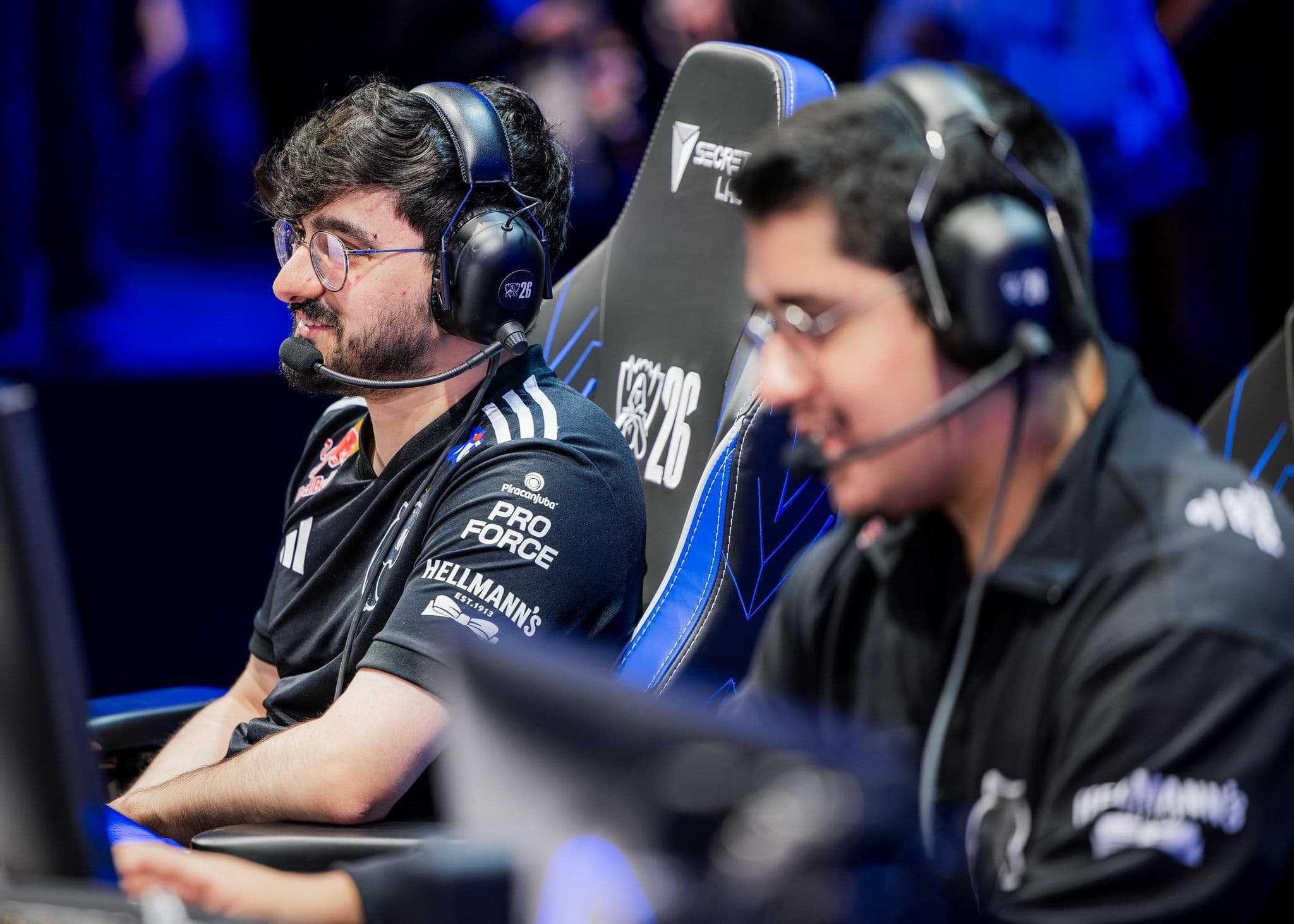 FURIA top laner Guigo smiles while seated at his player station during Worlds 2026