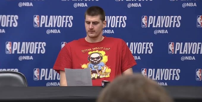 Nikola Jokic wearing a SoloRenektonOnly T-shirt
