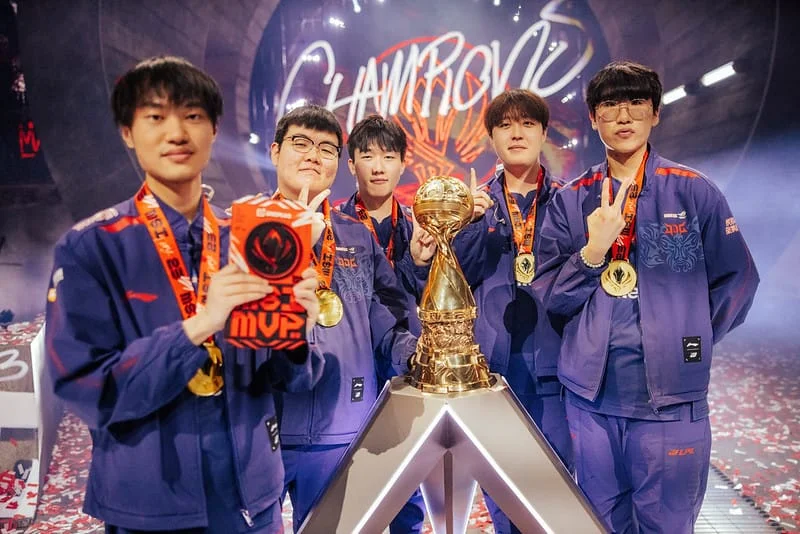 Bilibili Gaming League of Legends team celebrating their MSI 2024 championship victory with the trophy on stage